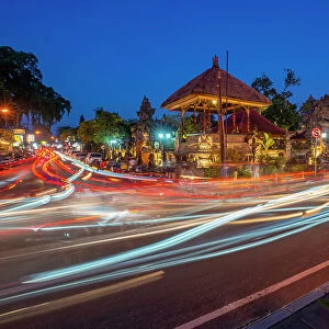 View of car trail lights and Ubud Palace at dusk, Ubud, Kabupaten Gianyar, Bali, Indonesia, South East Asia, Asia