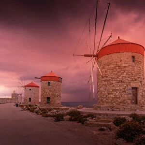 View of Rhodes Windmills at sunset, Old Rhodes Town, Rhodes, Dodecanese, Greek Islands, Greece, Europe