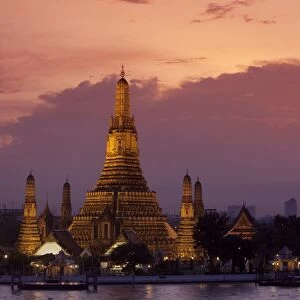 Bangkok, Thailand. The Wat Arun temple across the Chao Phraya River at sunset