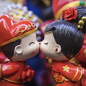 Boy and girl ornaments kissing, Old City market, Shanghai, China