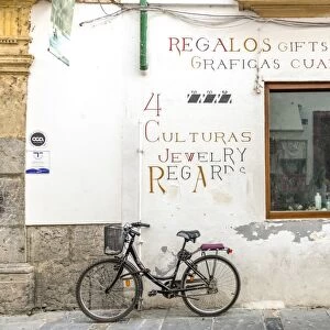 Spain, Andalusia, Cordoba. Bicycle against a wall in the old town