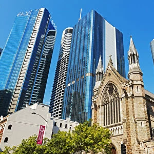St Stephens Cathedral dwarfed by glass skyscrapers, Brisbane, Queensland, Australia
