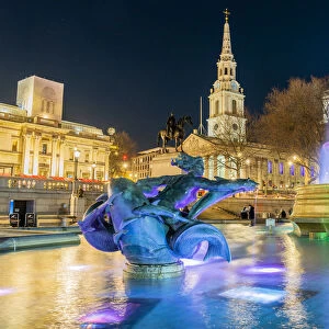 Trafalgar Square illuminated at night, London, England, UK