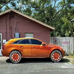 USA, Florida, Saint Petersburg, Big Wheel Custom Car, African-American Neighborhood