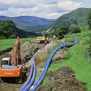 Laying a new water pipeline in the Lake District National Park Cumbria UK