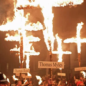 Burning crosses at the annual bonfire night parade held in Lewes, East Sussex