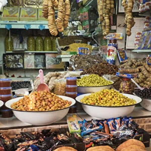 Africa, Morocco, Moulay Idriss. Market stall selling bread, olives, figs and other