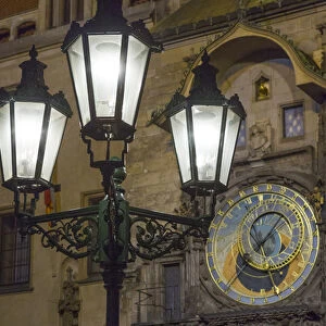 Europe, Czech Republic, Prague. Street lamp and Astronomical Clock at night. Credit as