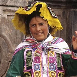 Life in Peru Cuzco in the mountains with native woman and her colorful dress high elevation