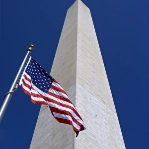 USA, Washington, D. C. View of American flag and the Washington Monument obelisk