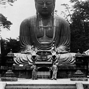 The Great Buddha of Kamakura, a bronze statue cast in 1252. Photograph, July 1900, by an unidentified Danish photographer. The man on the right is an English friend in Japanese clothing