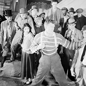 THE HAPPY WARRIOR, 1925. Andreas Randolph, Malcolm MacGregor, Olive Borden, Jack Henrick, William Dunn, and Gardener James in a scene from the film