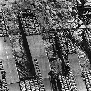 HOOVER DAM, 1933. Concrete being set in place on a side wall of Hoover Dam on the Colorado River