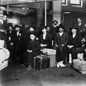 IMMIGRANTS: ELLIS ISLAND. A group of Italian men and boys at Ellis Island