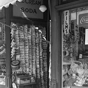 NEWSSTAND, 1937. A newsstand in Manchester, New Hampshire. Photograph by Edwin Locke