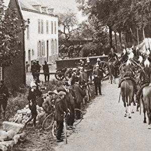 WWI: BELGIUM, 1914. French lancers passing through a small town in Belgium. Photograph