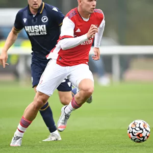 Arsenal's Emile Smith Rowe Outmaneuvers Millwall's Billy Mitchell in Pre-Season Friendly