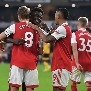 Arsenal's Martin Odegaard and Bukayo Saka Celebrate Goals Against Wolverhampton Wanderers in Premier League Match, 2022-23