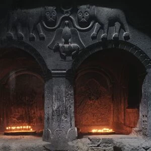 Armenia, Kotayk, Geghard, candles burning in chamber of Geghard Monastery