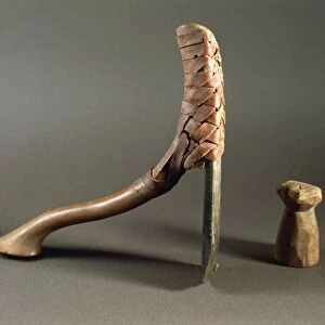 Axe with a straight cut bronze blade and a wooden handle, eighteenth dynasty, wooden sleeker