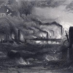Black Country near Bilston, Staffordshire, England, at night, showing glowing furnaces