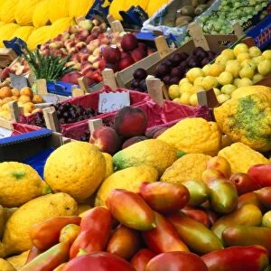 Italy, Sicily, Noto, variety of fresh fruit products on market stall