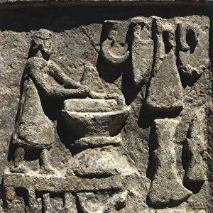 Relief depicting a blacksmith in his workshop from Ostia