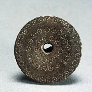Spindle whorl decorated with evil eye