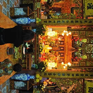 Women praying in a Hanoi buddhist temple