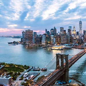 Aerial of New York city and Brooklyn bridge at dusk