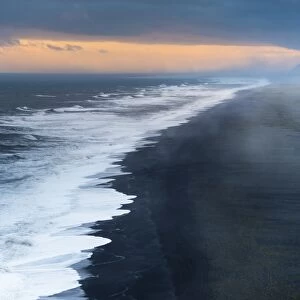 Dramatic clouds, black sandy beach near Dyrholaey, south coast, Southern Region, Iceland