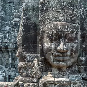 Giant Buddha stone faces inside Bayon temple, Angkor, Cambodia