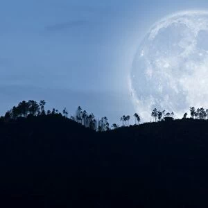 Full moon over the hills