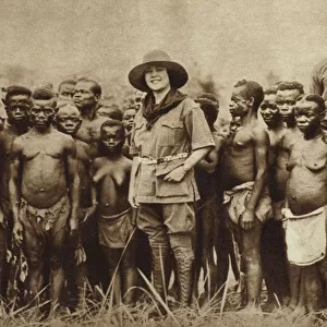American explorer and his wife with a group of African Pygmies in the Belgian Congo (b / w photo)