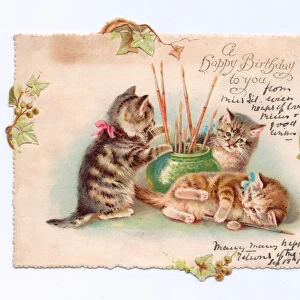 A Victorian Birthday card of three kittens playing with artist paint brushes in a bowl, c