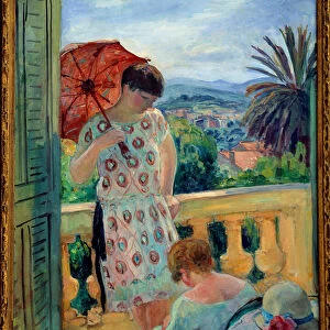 Two women on a balcony or on the balcony, in view of the Esterel