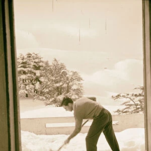 Man shoveling snow Hotel des Cedres Cedars Lebanon