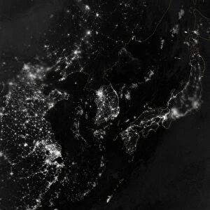 Satellite view of the Korean Peninsula showing city lights at night