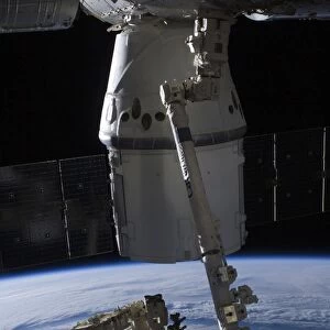 The SpaceX Dragon commercial cargo craft berthed to the ISS