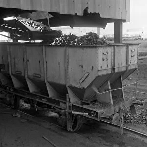 A rail truck being loaded with coal, Lynemouth Colliery, Northumberland, 1963. Artist