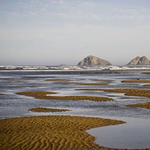 Three Arch Rocks Are Viewed From The Mouth Of Netarts Bay; Netarts, Oregon, United States Of America