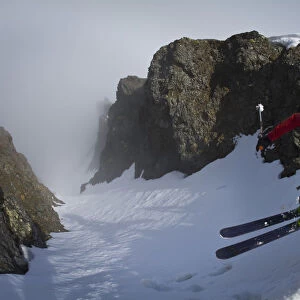 Backcountry Skier On West Twin Peak Near Eklutna, Western Chugach Mountains, Southcentral Alaska, Winter