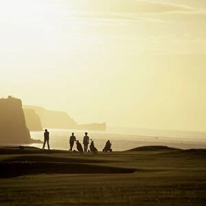 Ballycastle Golf Club, Co Antrim, Ireland; Silhouetted People Playing Golf