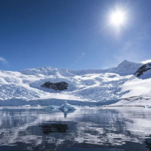 Bright Sun And Snow On The Mountains Reflected In The Water Of Neko Harbour; Antarctica