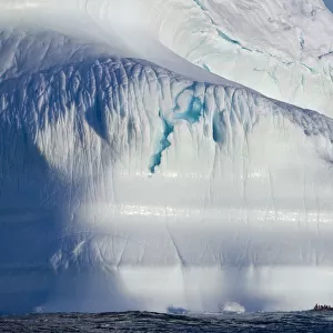 A Composite Image Of Tourists Exploring An Iceberg On Their Journey Throughout The Canadian Arctic; Nunavut, Canada