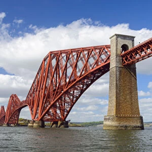 The famous Forth Bridge over Firth of Forth at low tide at South Queensferry in Edinburgh, Scotland, United Kingdom