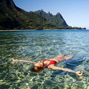 Hawaii, Kauai, Tunnels Beach, Woman Floats In The Ocean