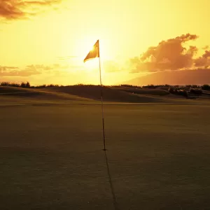 Hawaii, Maui, Kapalua Golf Club Plantation Course, 4Th Hole Flag At Sunset