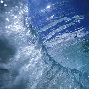 Hawaii, View Of A Wave From Underwater Looking At Surface Down The Curl