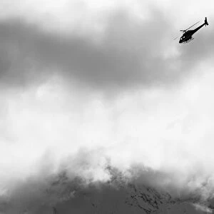 Heli Ski Helicopter Flying Amongst Fog And Clouds, New Zealand